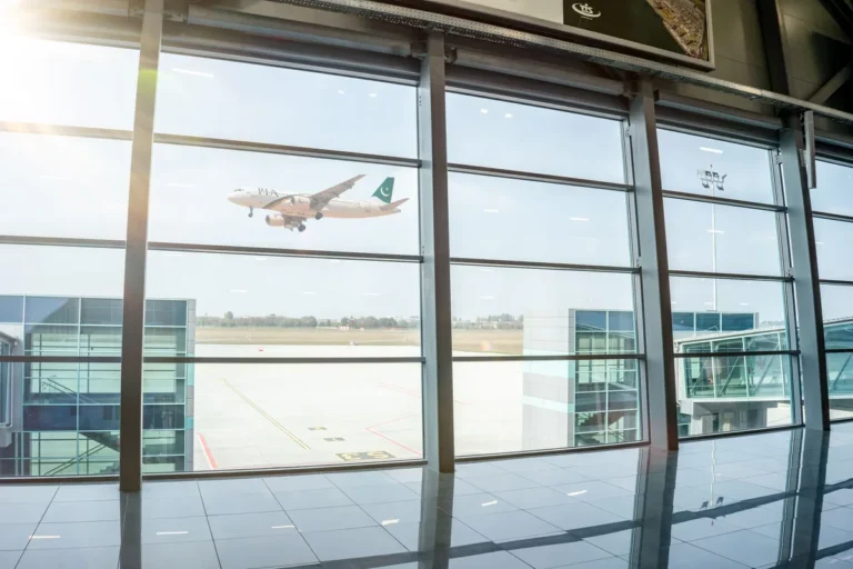 Aircraft seen through airport terminal windows in Lahore, Pakistan.