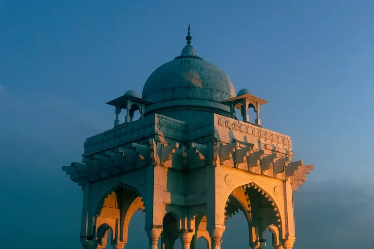 White domed Baradari pavilion with arched sides lit by the setting sun in Fatima Jinnah Park, Islamabad